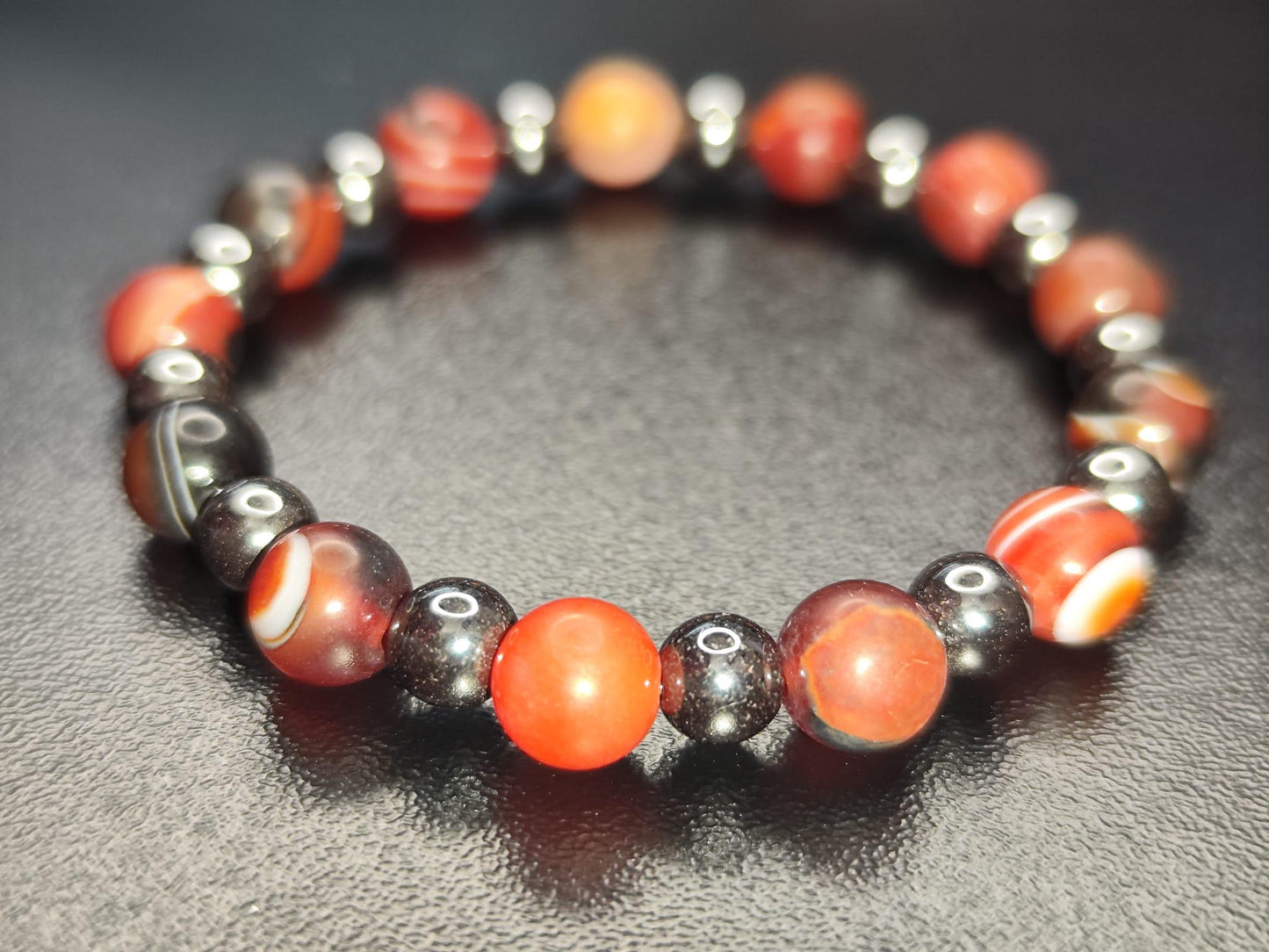 Handmade bracelet with black gallstone and red linear agate beads – gemstone jewelry for energy & protection
